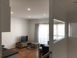 Premium Studio, 1 Bedroom | Living area | 33-inch Smart TV with digital channels, DVD player