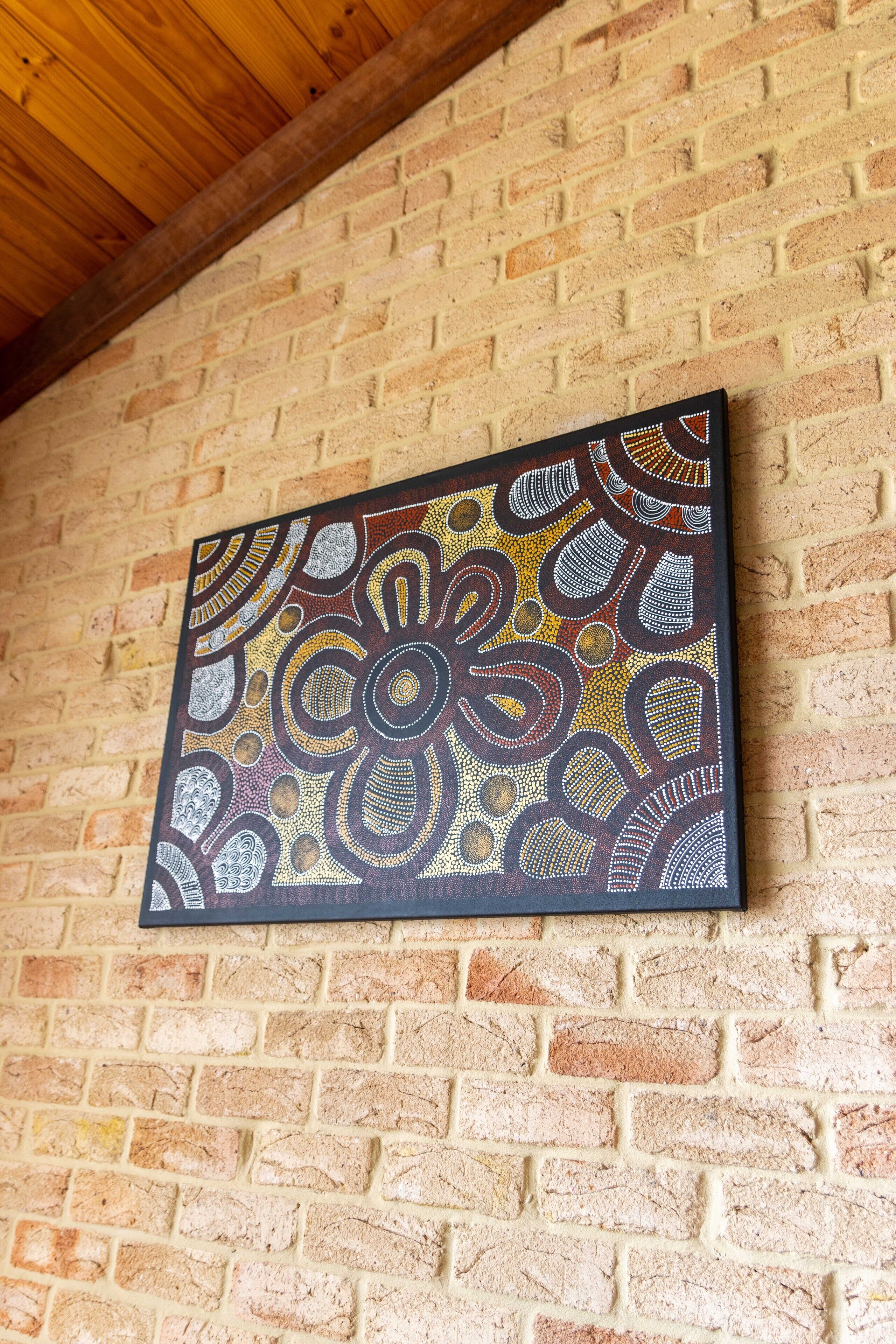 A painting on a brick wall.