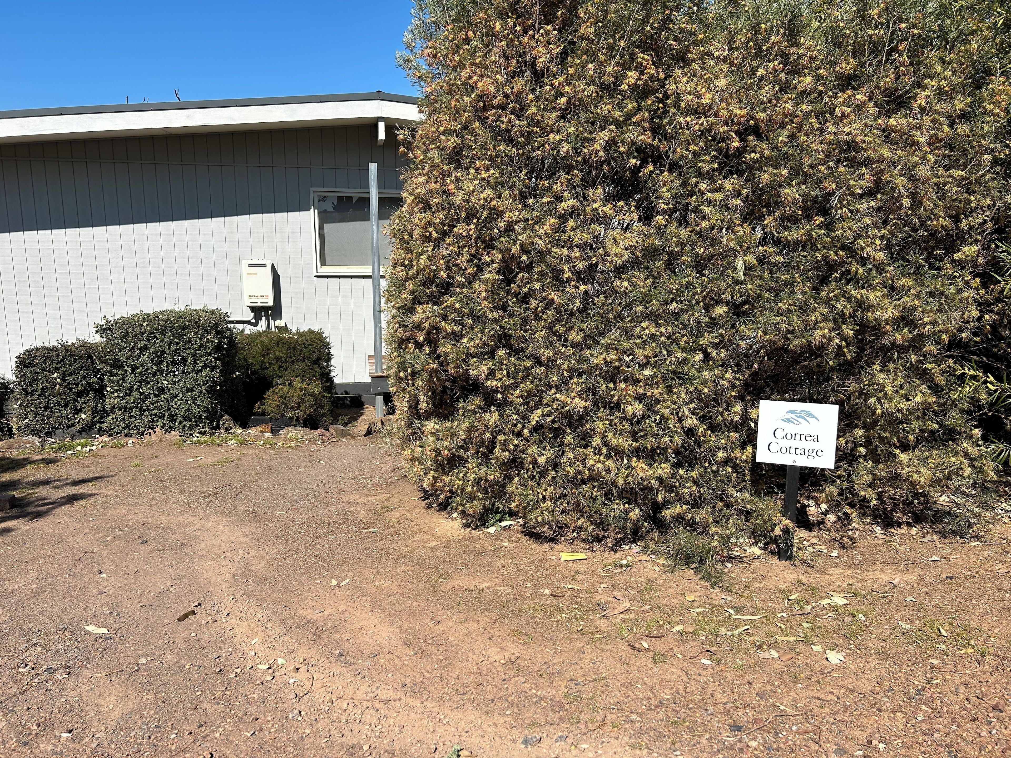 A building with a sign reading "Correa Cottage."