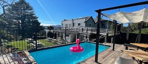Outdoor pool, open 9:00 AM to 9:00 PM, pool umbrellas, pool loungers