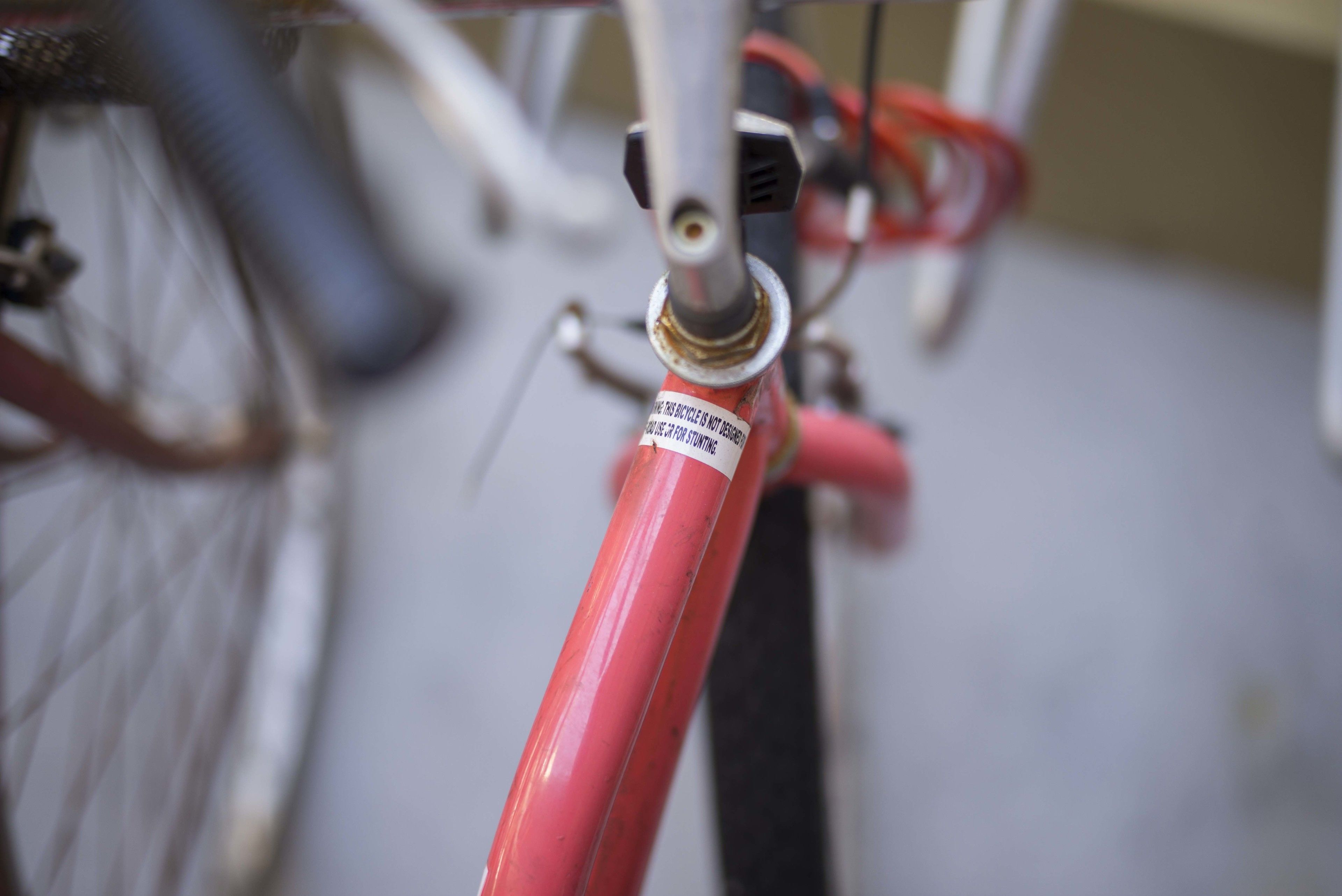 A close-up of a bicycle's front fork and brake system.