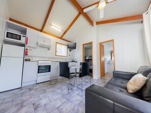 Standard Cabin | Private kitchen | Fridge, stovetop, cookware/dishes/utensils