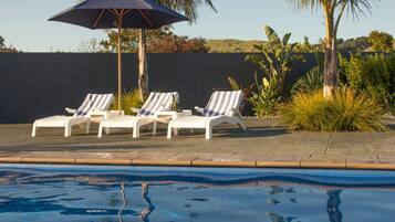 Seasonal outdoor pool, open 8 AM to 8 PM, pool umbrellas, sun loungers