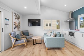 Premium Villa | Living area - Tasman Holiday Parks – Beachaven (Waihi Beach)