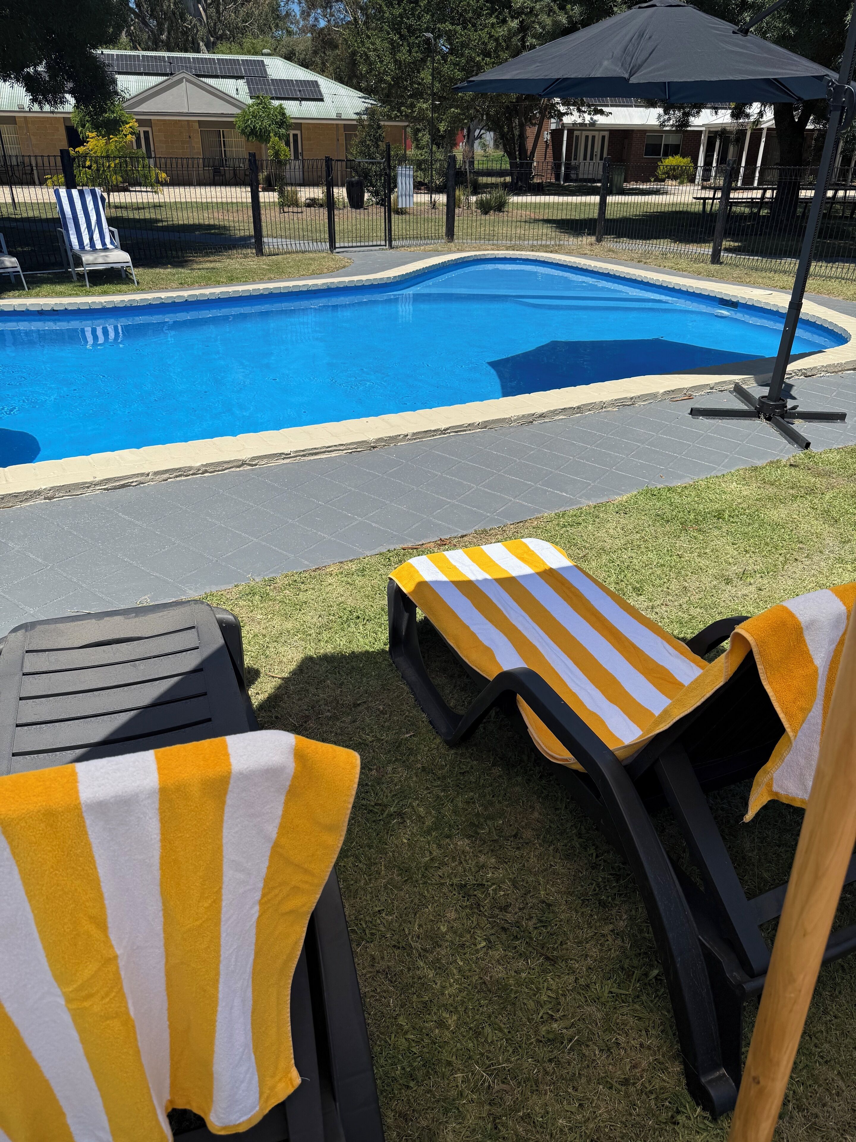 Outdoor pool, a heated pool, sun loungers