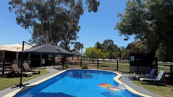 Outdoor pool, a heated pool, pool loungers