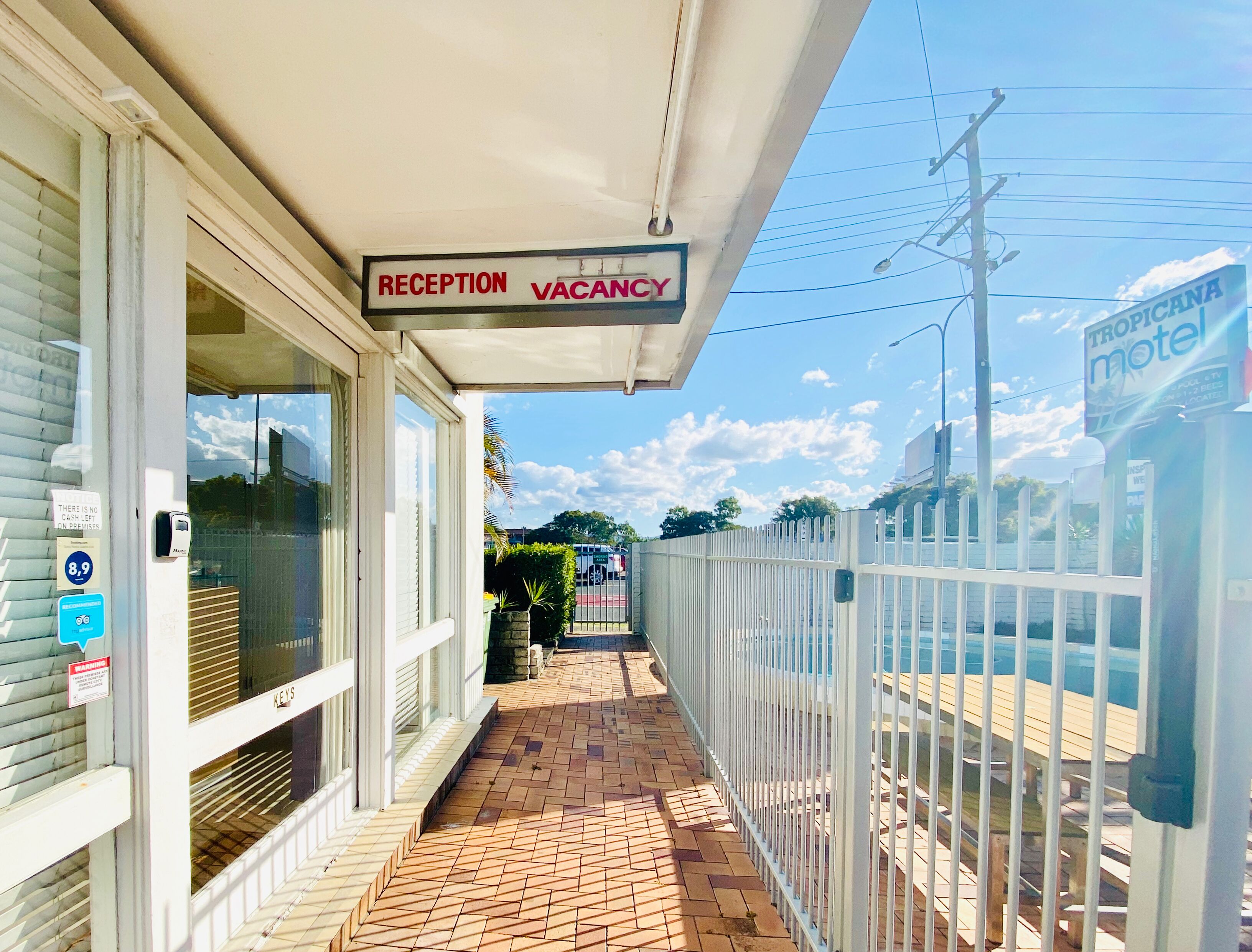 A reception area with a sign indicating vacancy.