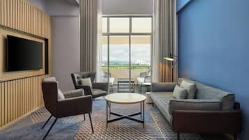 Apartemen Keluarga, 1 Tempat Tidur Double, balkon | Area keluarga | TV layar datar