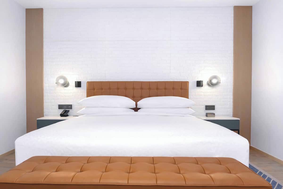 Deluxe Room, 1 King Bed, Balcony | Minibar, in-room safe, free cribs/infant beds, free WiFi