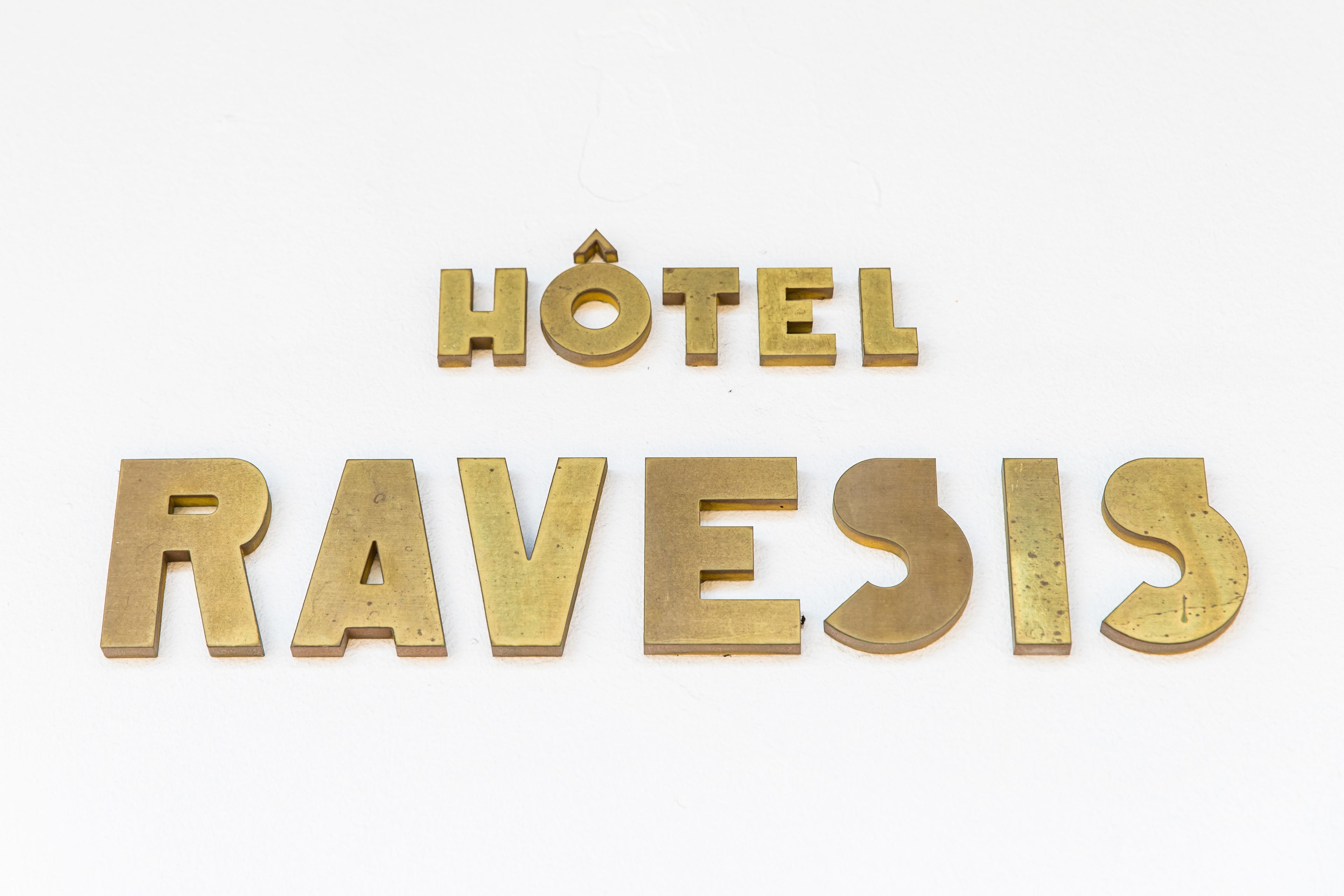 The name of a hotel spelled out in large, gold-colored letters.