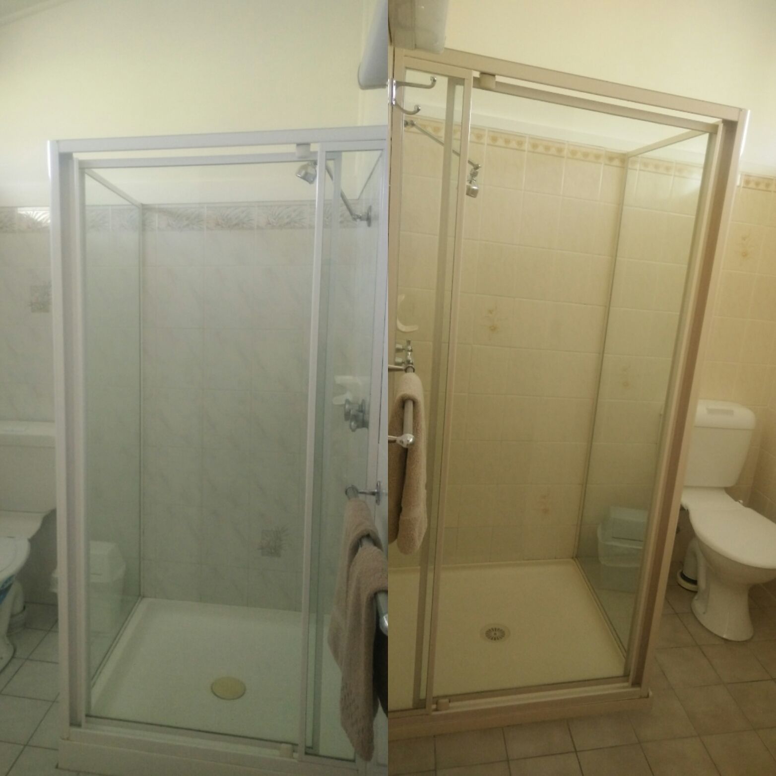 A bathroom with a glass-enclosed shower, a toilet, and a sink.