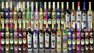 A variety of bottles with labels, likely containing different beverages or products.