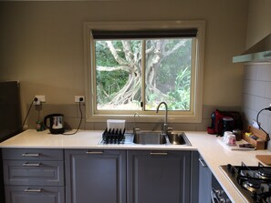 Love Cottage | Private kitchen | Microwave, oven, stovetop, cookware/dishes/utensils - Maleny Luxury Cottages (Curramore)