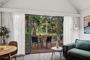 Luxury Spa Suite, Balcony - accessible by 1 flight of stairs | Living area | 55-inch TV with cable channels