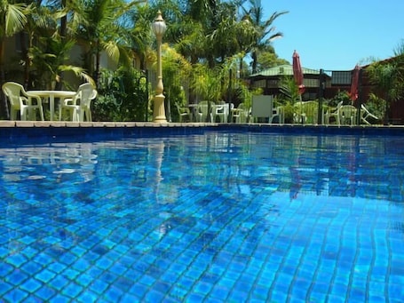 Outdoor pool, open 8:00 AM to 10:00 PM, sun loungers