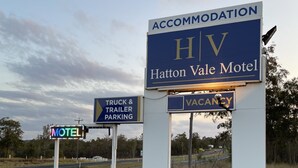 A motel sign with 'Havton Vale Motel' and 'Accommodation HV' on a blue background. - Hatton Vale Motel (Hatton Vale)
