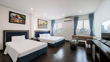 Family Double Room | Minibar, in-room safe, blackout curtains, iron/ironing board