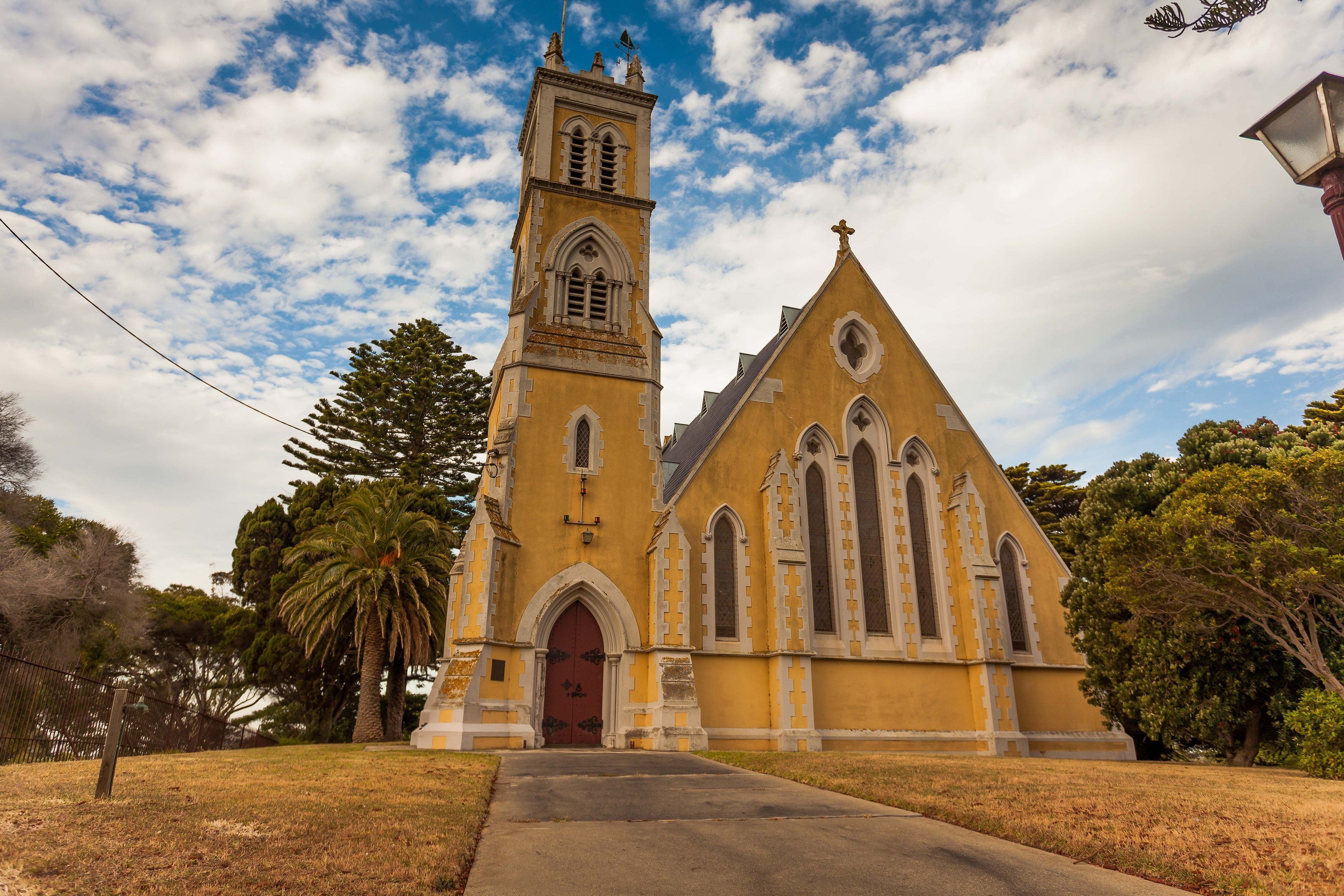 A church with a prominent tower and arched windows.