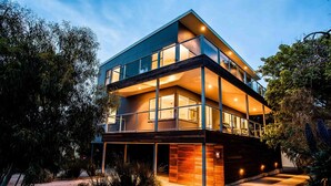 A modern two-story house with large windows and a balcony. - Point Lonsdale Holiday Apartments - Adults only (Point Lonsdale)