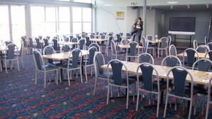 A conference room with tables and chairs arranged for a meeting. - Christies Beach Hotel (Christies Beach)
