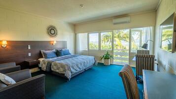 Superior Room | Minibar, in-room safe, desk, iron/ironing board