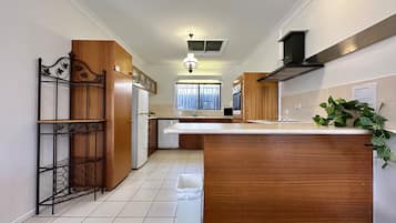 Apartment | Private kitchen | Full-sized fridge, microwave, stovetop, electric kettle