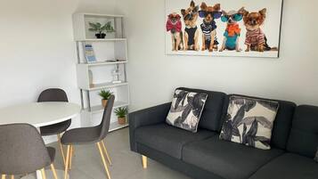 Deluxe Apartment | Living area | TV