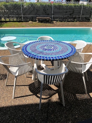 Outdoor pool, open 8:00 AM to 9:00 PM, pool loungers