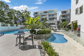 2 outdoor pools, a heated pool, open 8:00 AM to 9:00 PM, pool umbrellas - Sun Lagoon Resort (Noosa Heads)