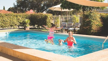 Outdoor pool, open 10:00 AM to 9:30 PM, pool loungers