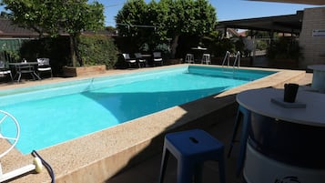 Outdoor pool, open 10:00 AM to 9:00 PM, pool loungers