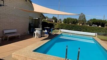 Outdoor pool, open 10:00 AM to 9:00 PM, pool loungers