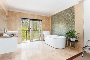 Separate tub and shower, jetted tub, hair dryer, slippers