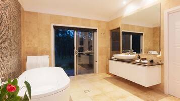 Separate tub and shower, hair dryer, bathrobes, slippers