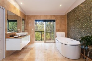 Separate tub and shower, jetted tub, hair dryer, slippers