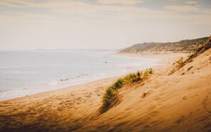 A beach with a sandy shore and gentle waves. - Port Campbell Parkview Motel & Apartments (Port Campbell)