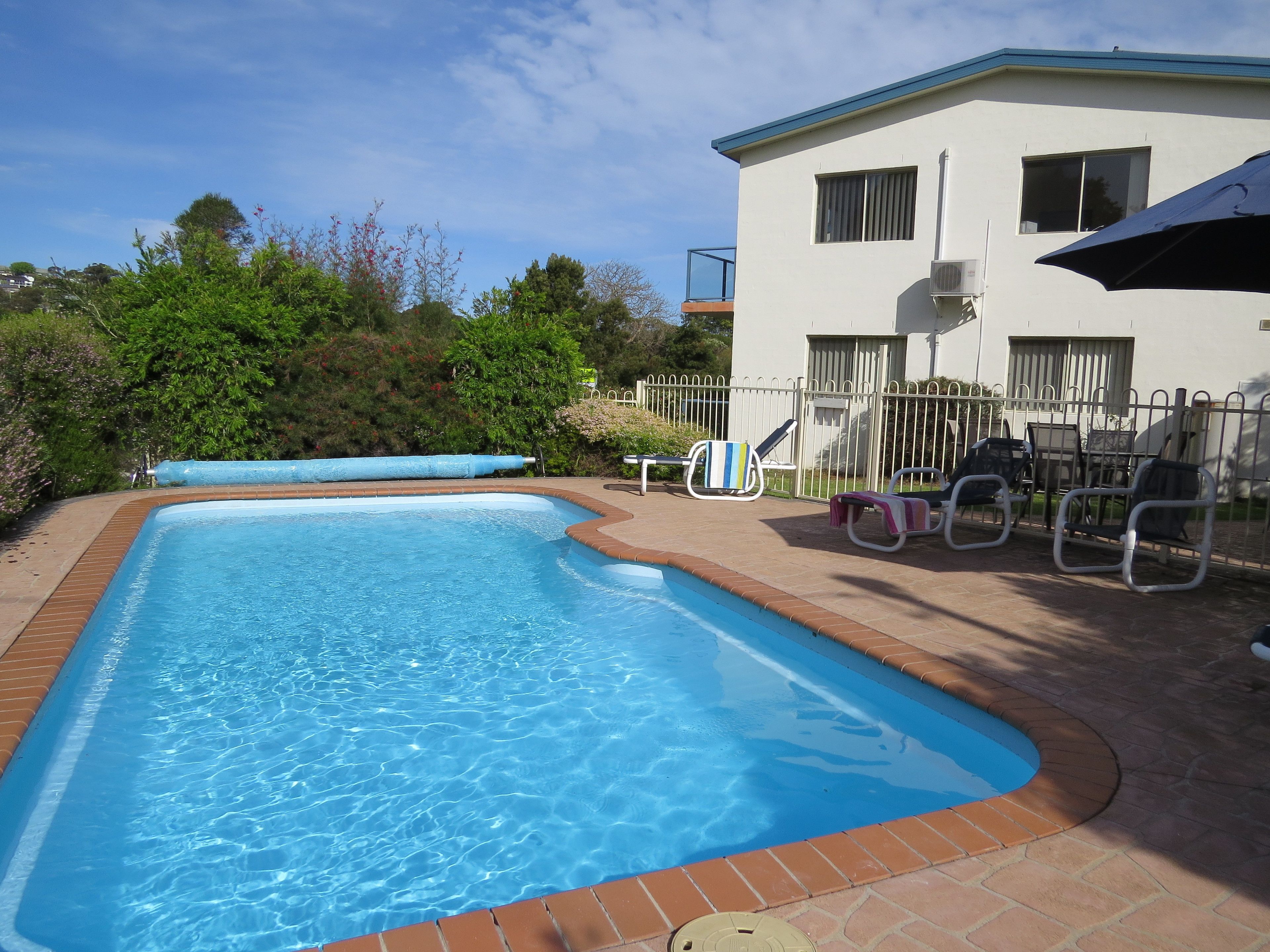 Seasonal outdoor pool, pool umbrellas, pool loungers