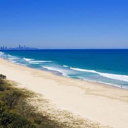 On the beach, white sand, beach umbrellas, beach towels