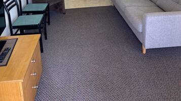 Family Suite | Living area | 82-cm flat-screen TV with digital channels, TV