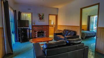 Two Bedroom Luxury Self Contained Spa Lodge | Living area | LCD TV