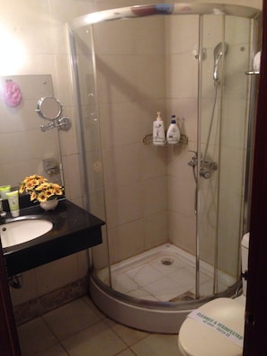 Shower, free toiletries, slippers, towels