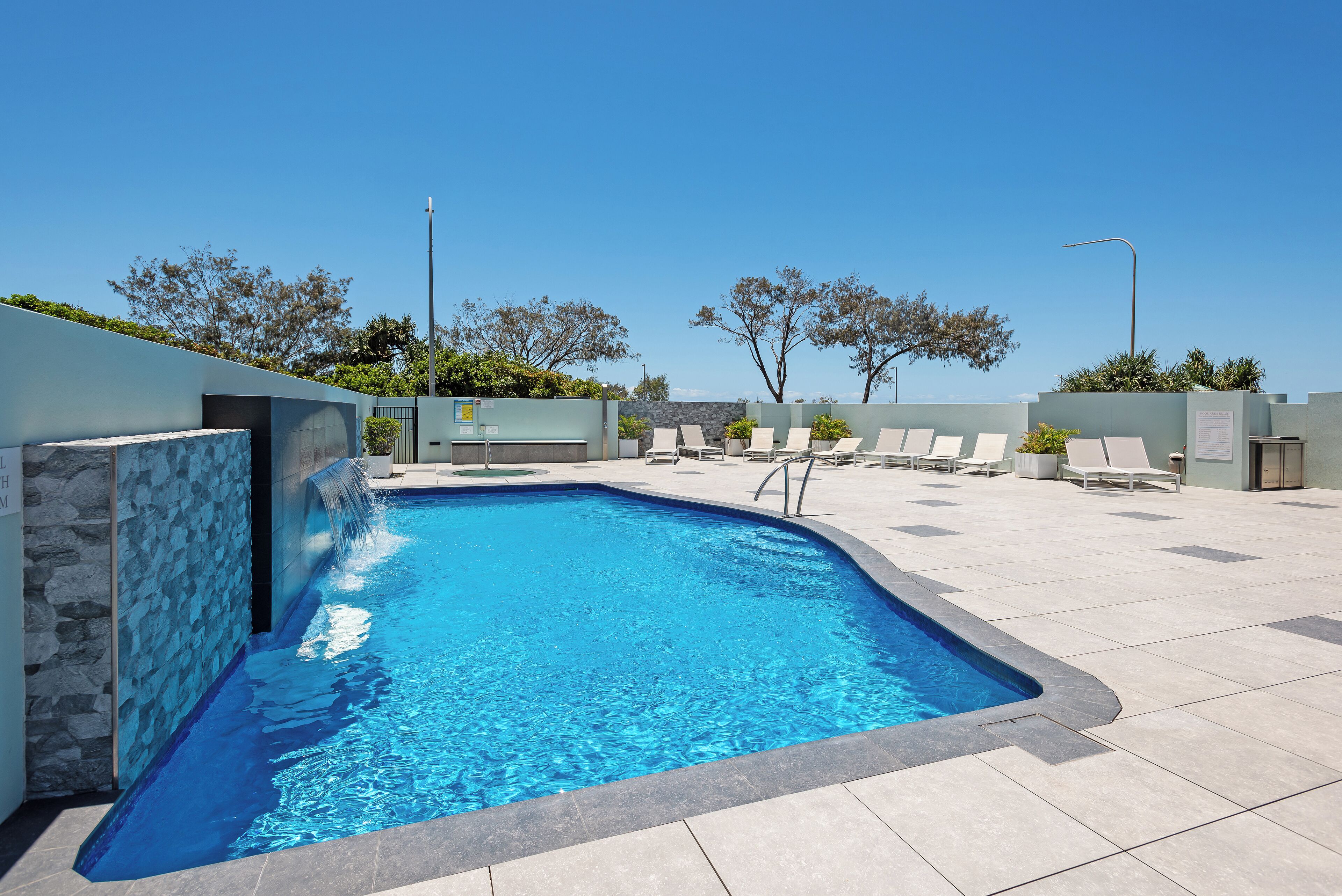 Outdoor pool, a heated pool, pool loungers