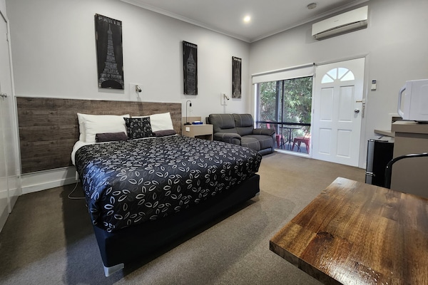 Deluxe Room | Down comforters, desk, blackout drapes, iron/ironing board