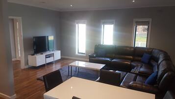 Comfort House, 3 Bedrooms, Accessible, Non Smoking | Living area | 55-inch flat-screen TV with satellite channels, TV, Netflix