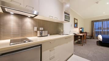 Fridge, microwave, stovetop, coffee/tea maker