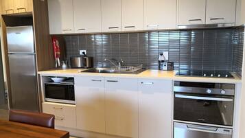 Fridge, microwave, stovetop, coffee/tea maker