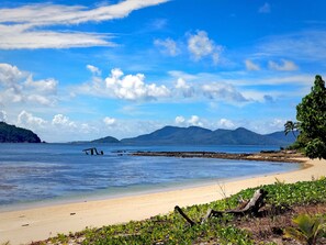 Beach nearby, white sand, beach towels