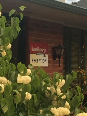 A reception sign for Lake Roodburgh Lodge.