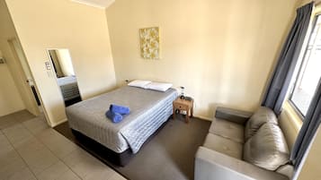 Deluxe Room, Non Smoking (Deluxe Queen Room) | Desk, iron/ironing board, free WiFi, bed sheets