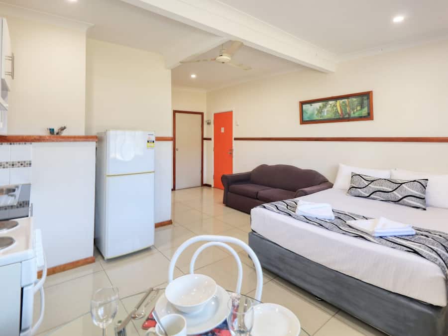 Premium bedding, desk, laptop workspace, iron/ironing board